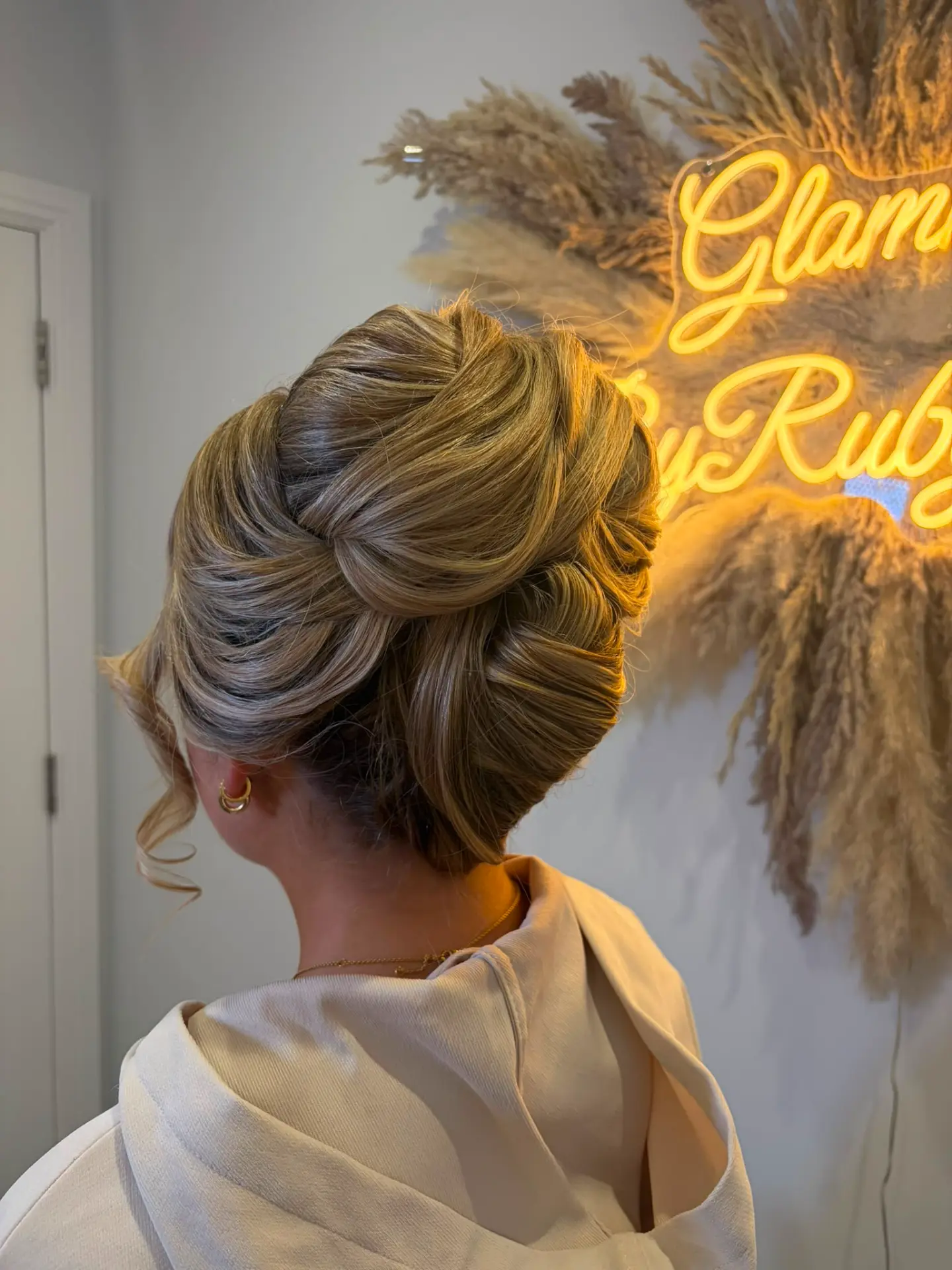 Sleek voluminous french roll updo