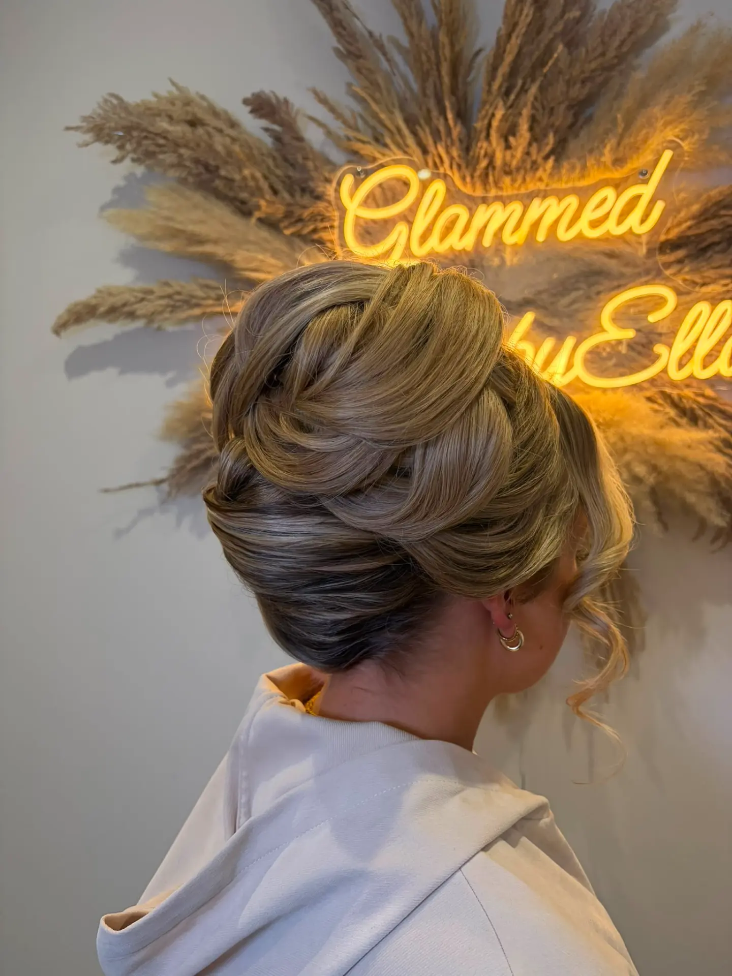 Full swept-up bun with braided detail