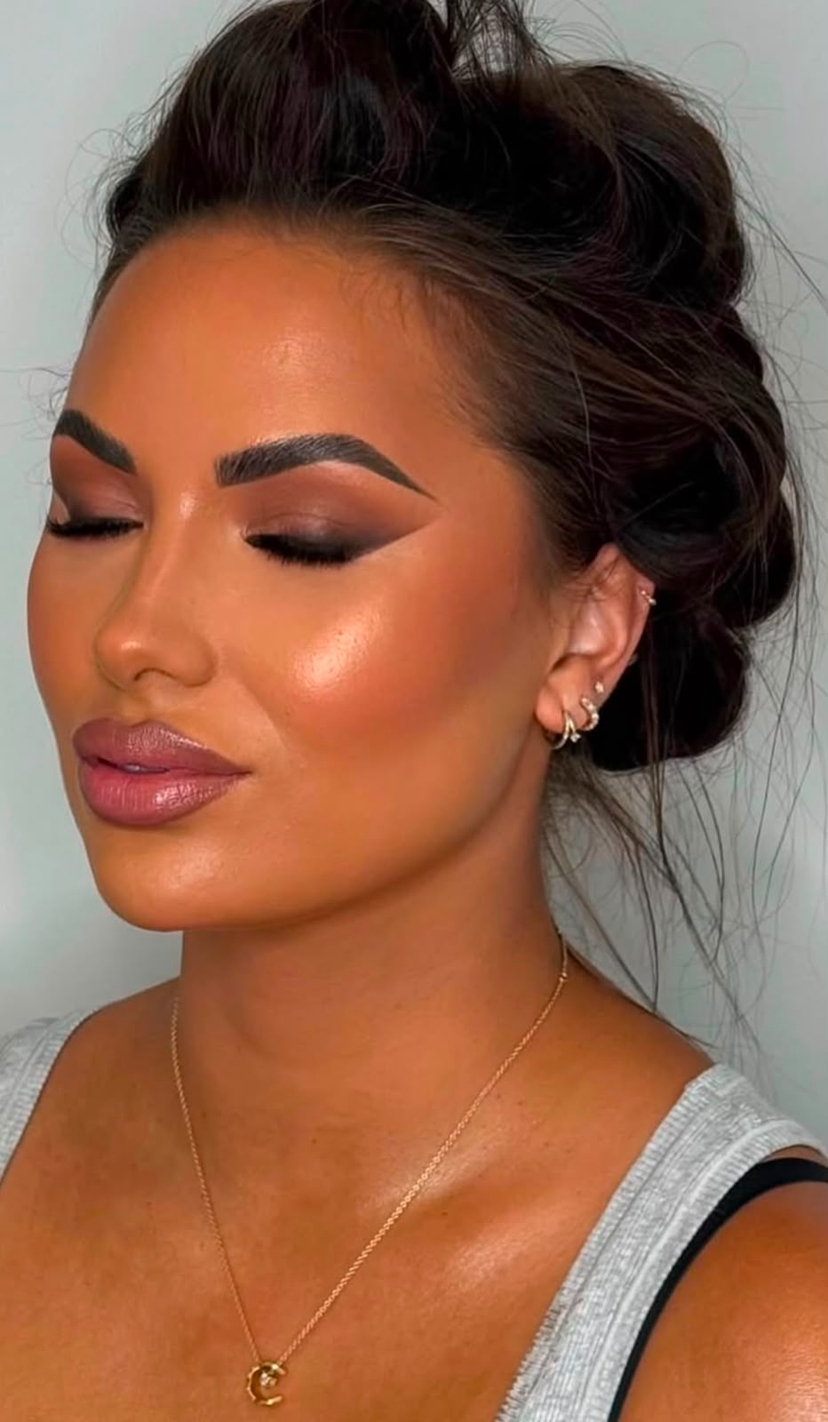 Bronzed glam makeup with a textured updo